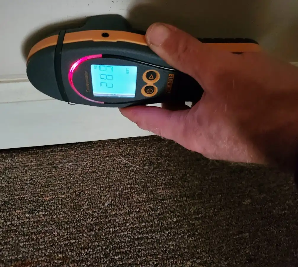 Moisture detection at baseboard during Storm Damage Restoration in Payson